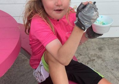 Oh yeah, that hits the spot. Abby eats some ice cream after pedaling all day.
