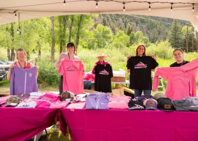 Gunnison Tough volunteers show off 2024 Merch