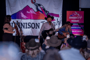 George Straight, DEan Dillon, and JeneeFleenor perform at the Gunnison Tough Songwriter Shuffle.